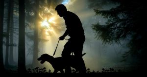 a hunter and his dog